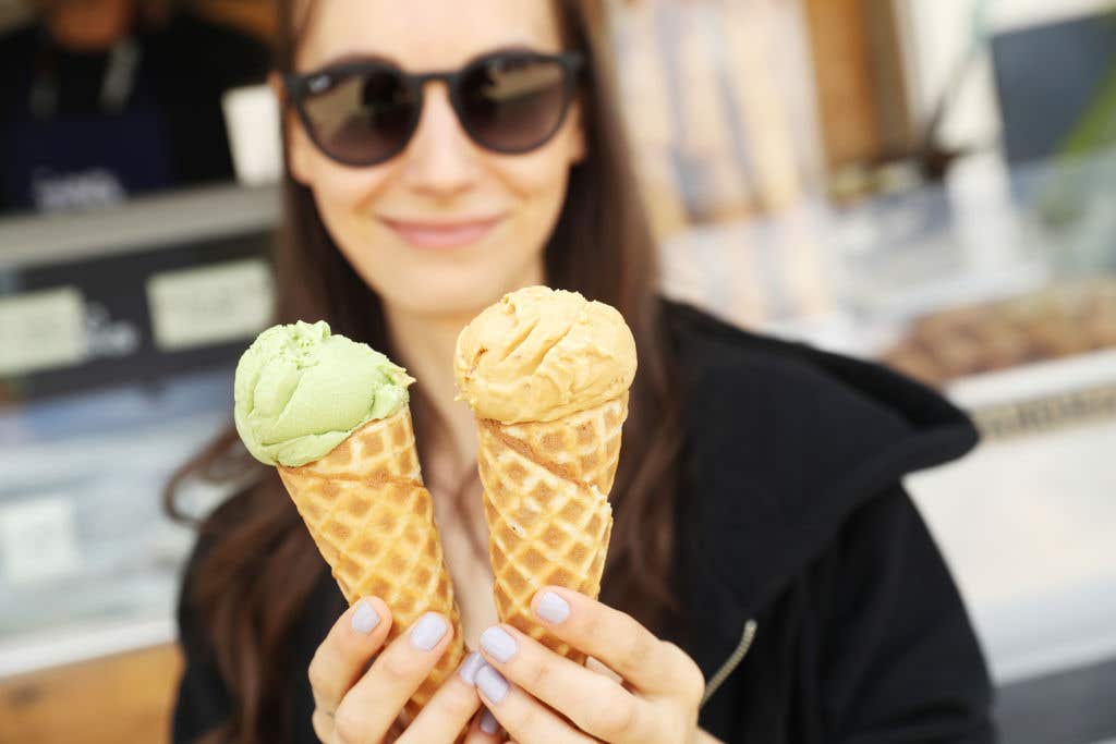 woman holding ice cream cones