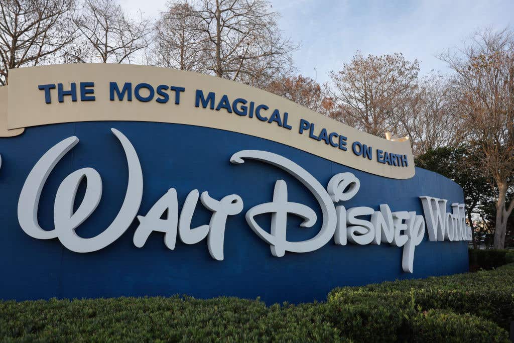 A sign welcomes visitors near an entrance to Walt Disney World in Orlando, Florida. Disney World employee sees the sign as they go to work.