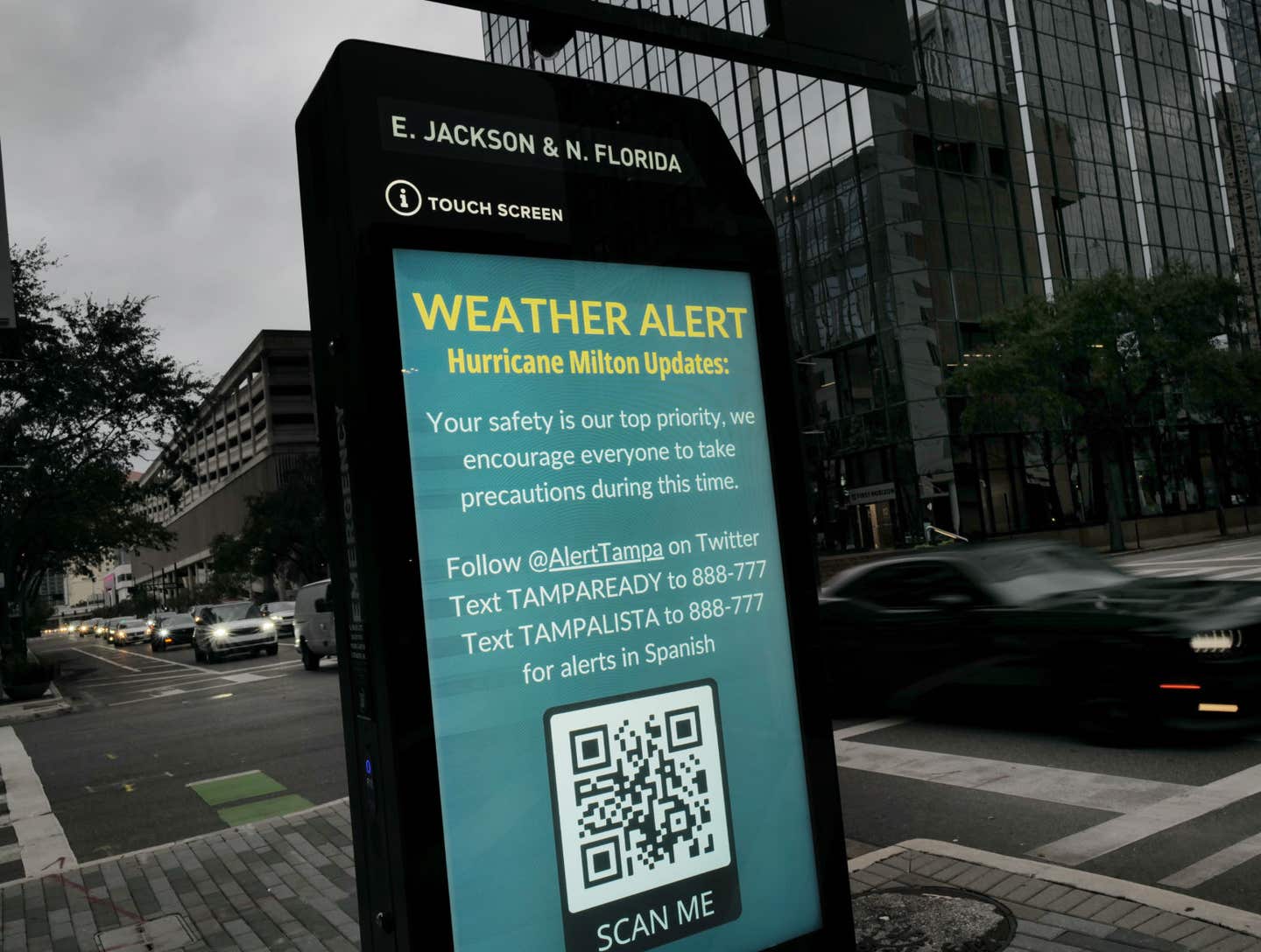 A weather alert is displayed along a sidewalk as Hurricane Milton churns in the Gulf of Mexico on October 07, 2024 in Tampa, Florida.