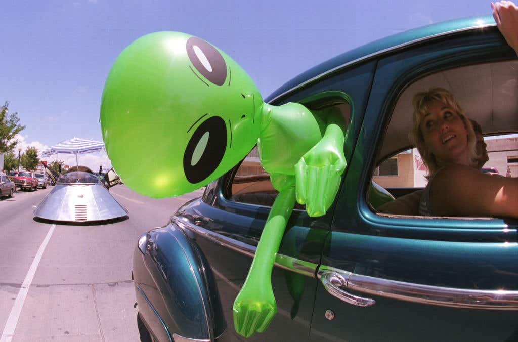 Blow up alien in a car out the window. Did A New York News Helicopter Catch Footage Of A UFO?