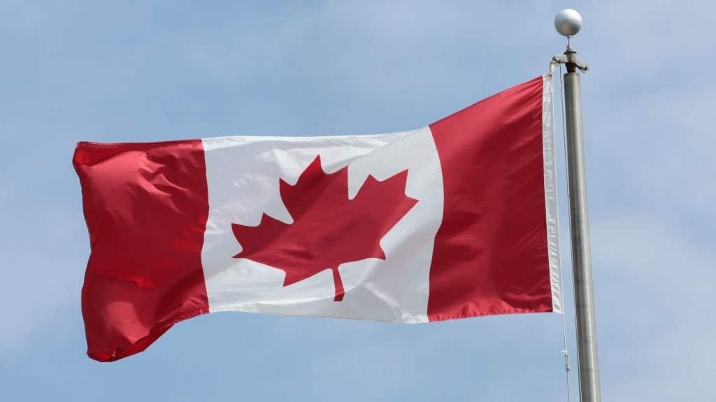 Canadian flag in the air. Canadian Man Gets Penis Stuck On Icy Sidewalk After Bar Fight