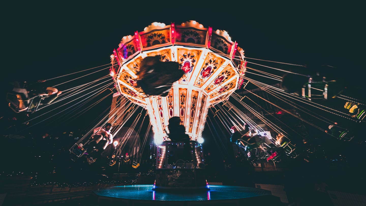 luminous carousel on market night