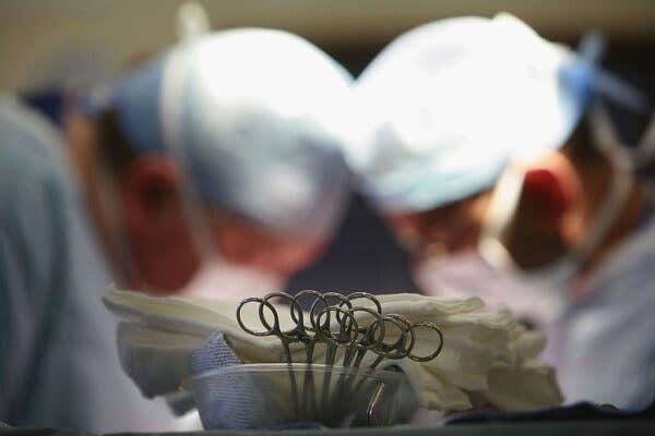 Surgeons performing surgery in a surgical room. Woman Saved Money For 10 Years To Get A Nose Job