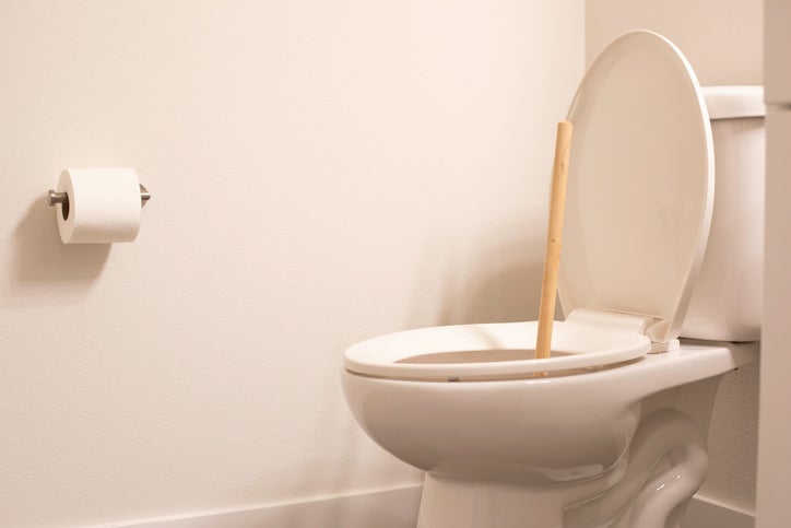 clogged toilet with plunger