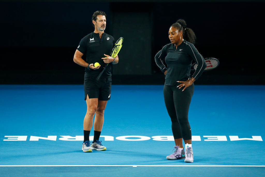 Serena Williams of United States speaks with coach Patrick Mouratoglou