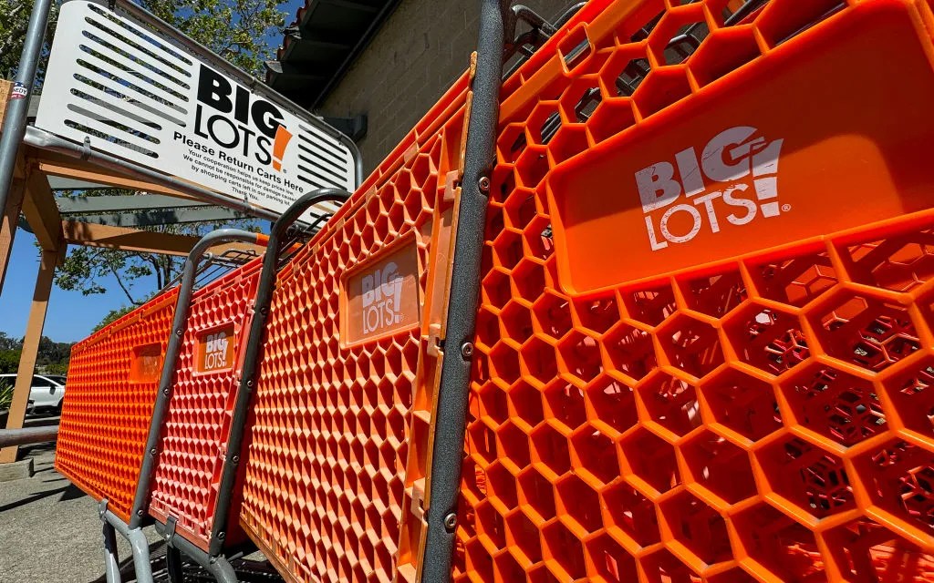 The Big Lots logo is displayed on shopping carts in front of a Big Lots store on June 07, 2024 in Hercules, California. Discount retailer reported first quarter earnings that fell short of analyst expectations with net sales of $1.009 billion compared to $1.124 billion one year ago. 