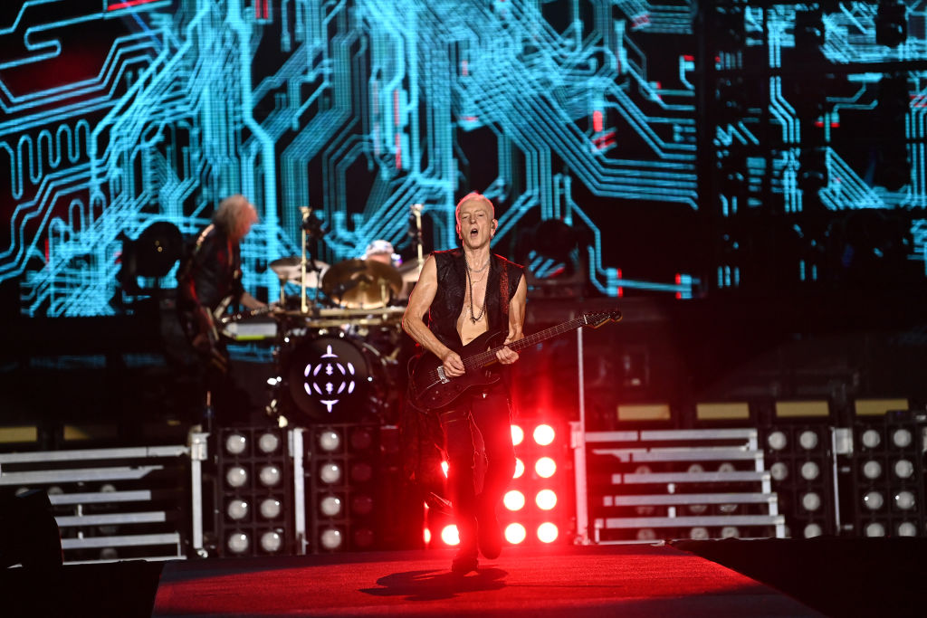 Phil Collen of Def Leppard performs onstage during the "Summer Stadium" tour at Truist Park on July 13, 2024 in Atlanta, Georgia. 